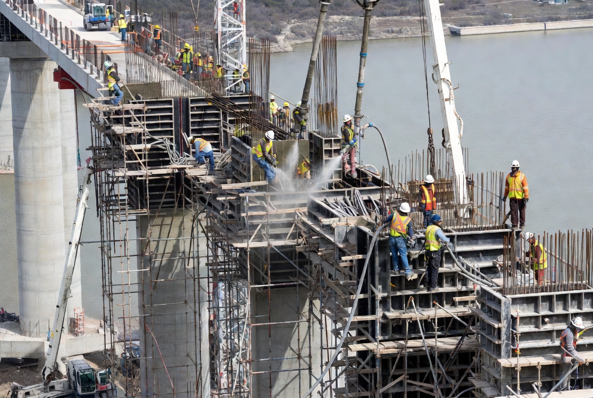 Bridge construction with gunite and shotcrete application — KIG places specialty insurance for infrastructure contractors and DOT bridge work