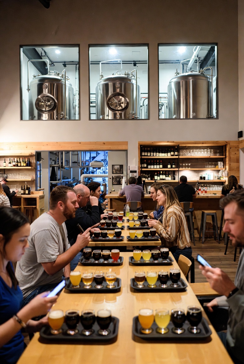 Brewery taproom patrons sampling beer flights for liquor liability insurance