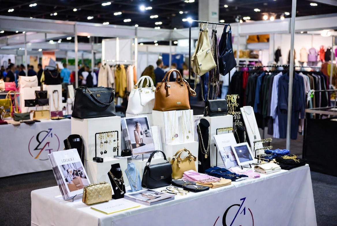 Fashion trade show vendor product display table with accessories and seasonal collections for trade show insurance