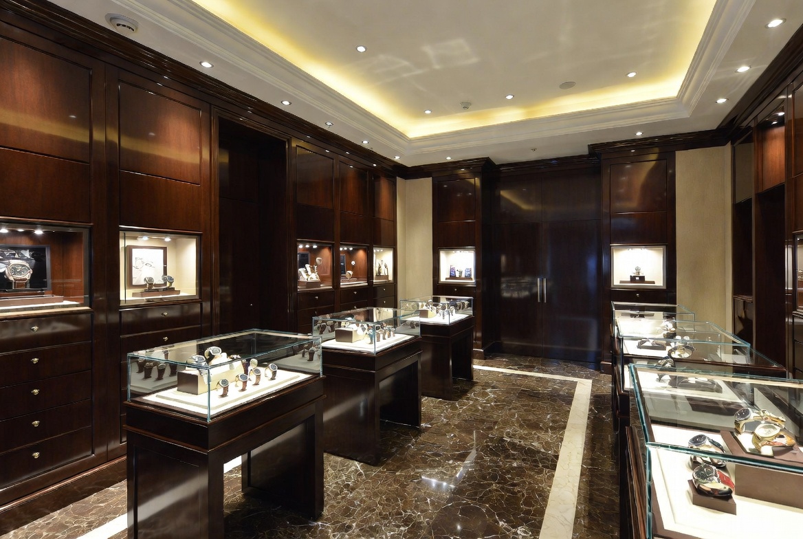 Luxury watch dealer showroom with high-end timepiece display cases and spotlighting for watch dealer insurance