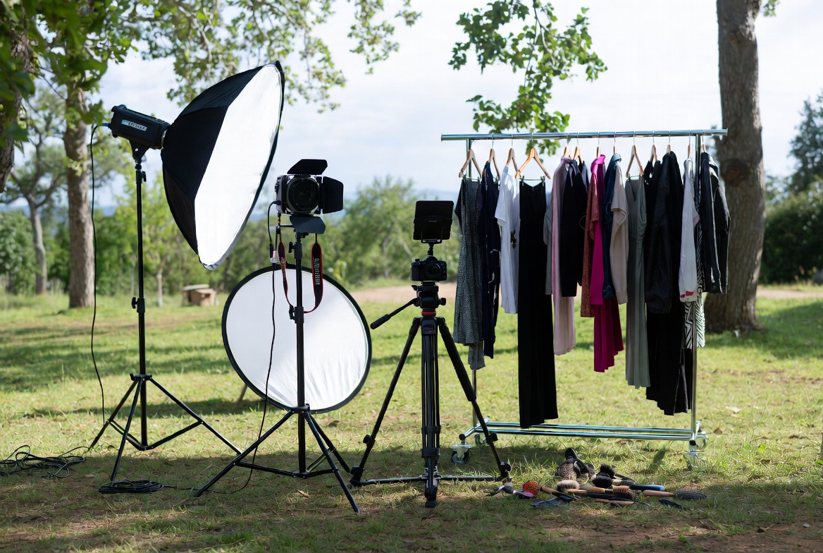 Outdoor fashion photoshoot location setup with natural lighting and portable equipment