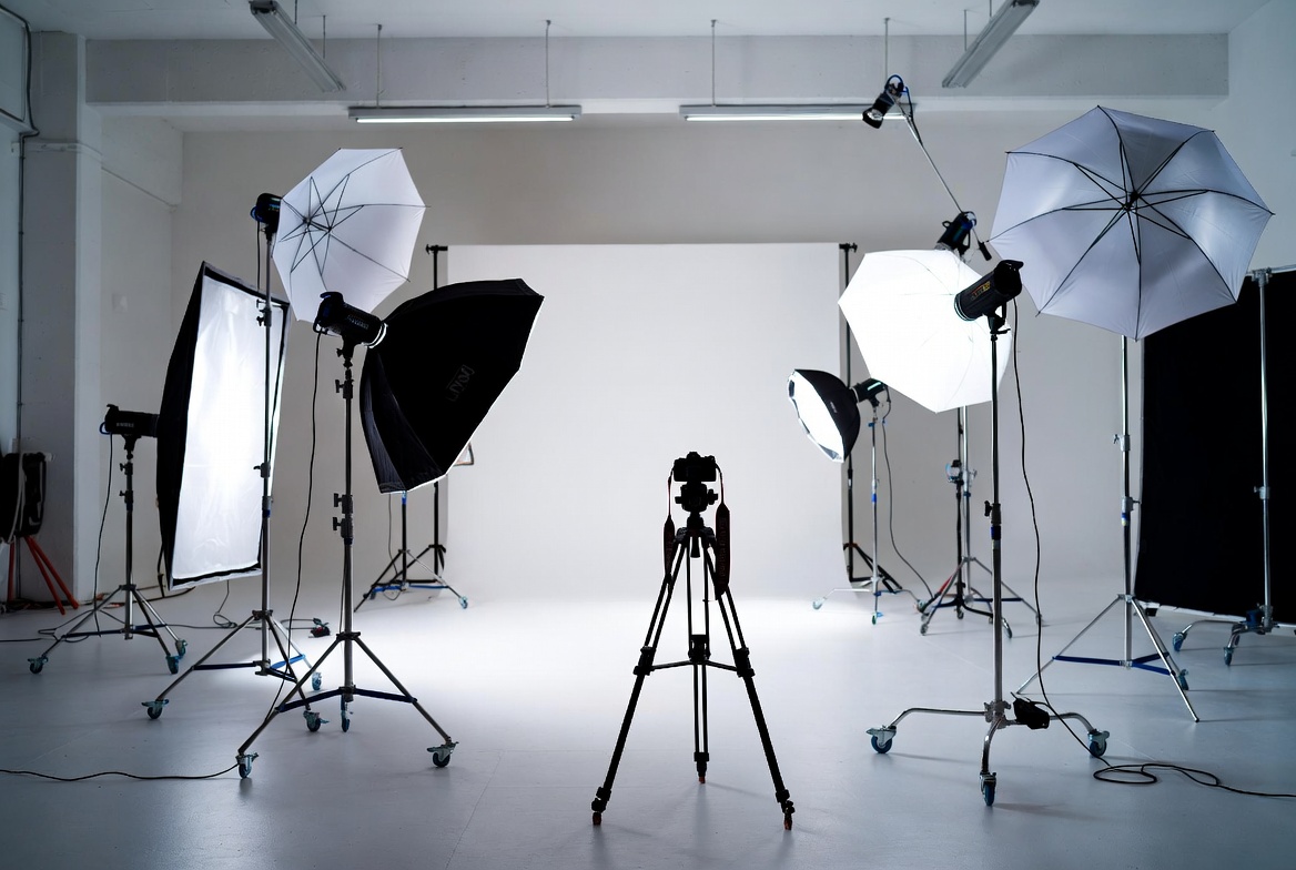 Professional fashion photography studio with seamless backdrops and professional lighting rigs
