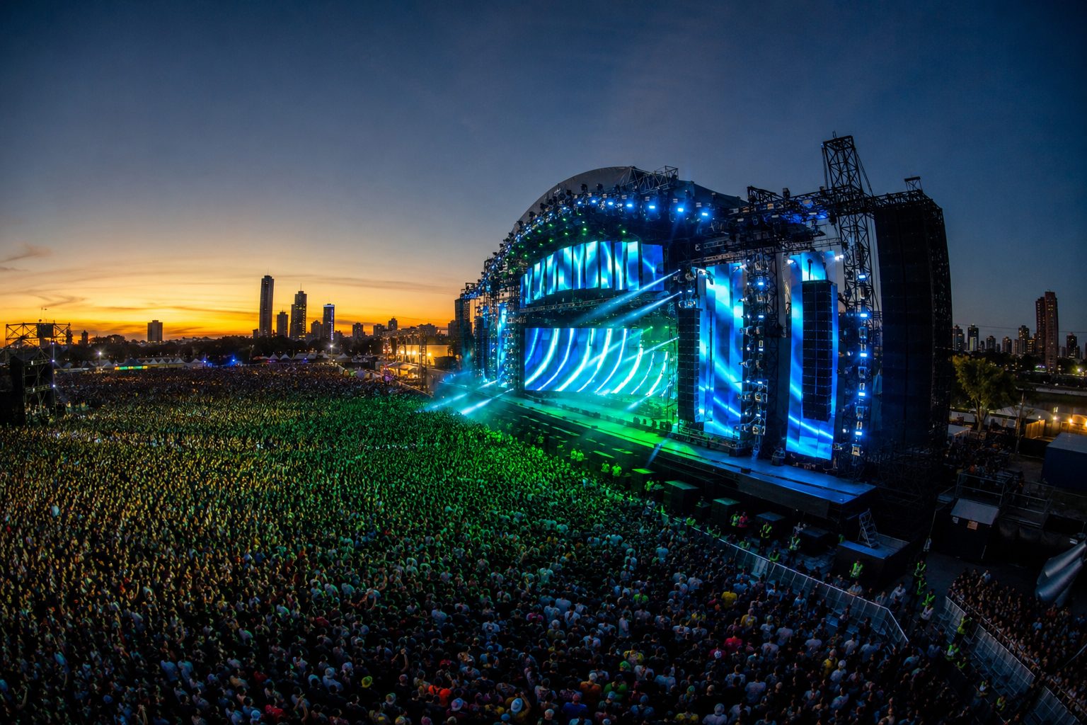 Rap tour arena stage against a city skyline, representing a multi-city tour insured as one coordinated program across every date